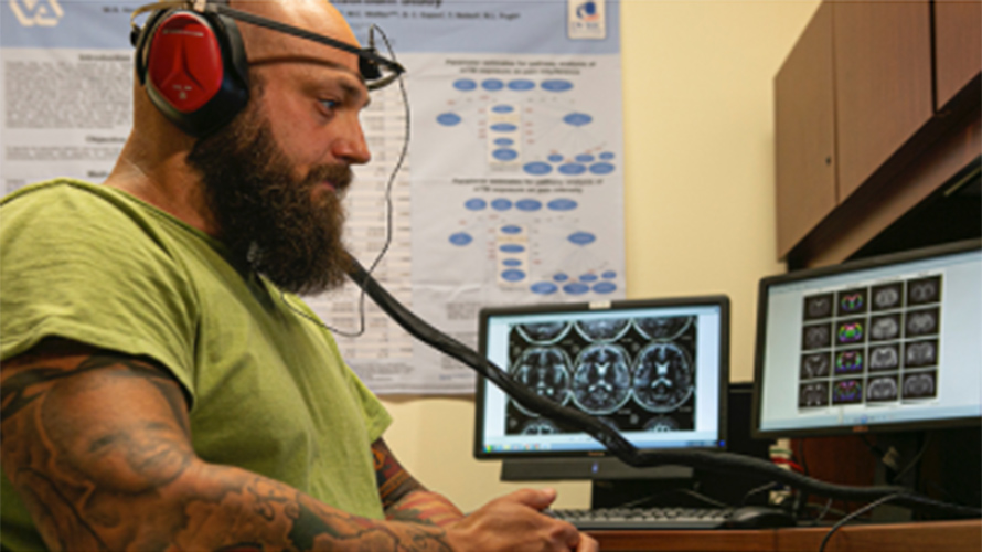 Man hooked up to a brain scanning machine