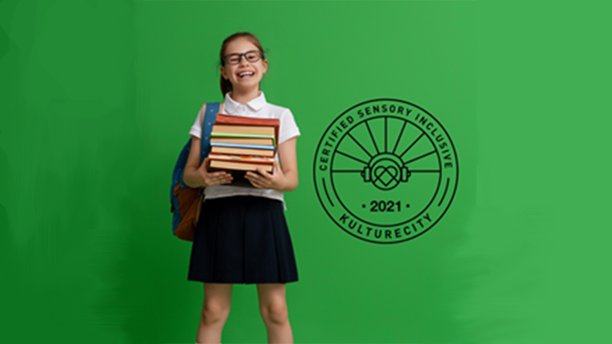 Girl holding school books next to KultureCity logo