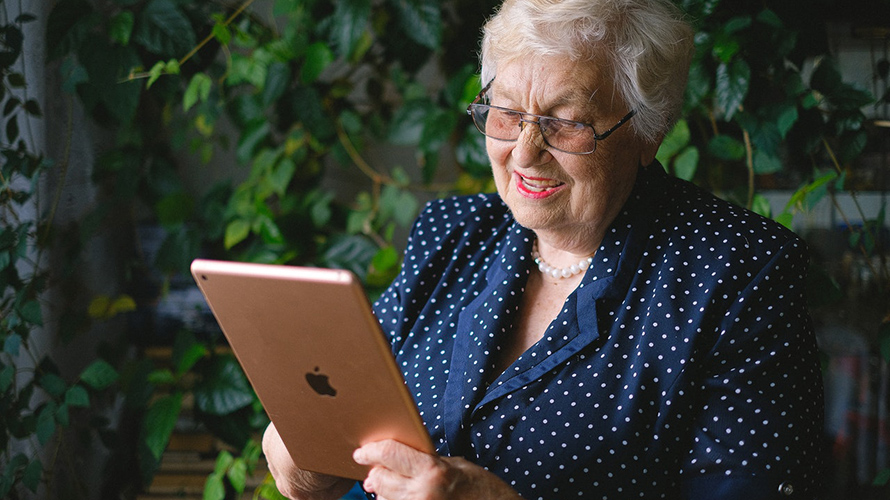 Older woman looking at tablet