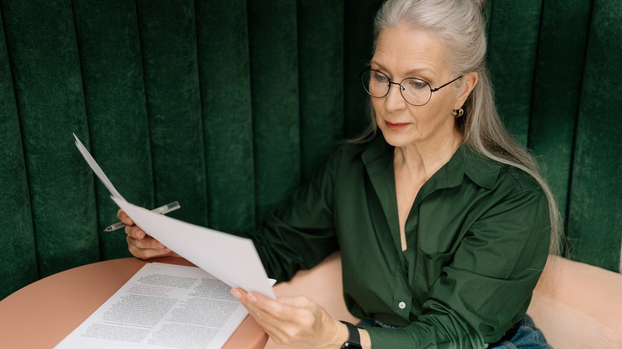 Older woman reviewing papers