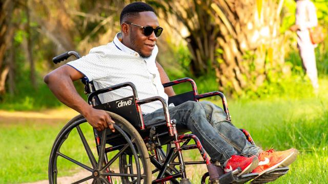 Man in wheelchair in a park
